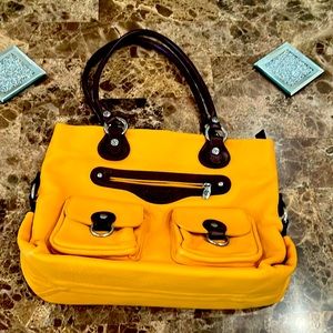 Brand New Valentina purse has outside & inside zipper pockets